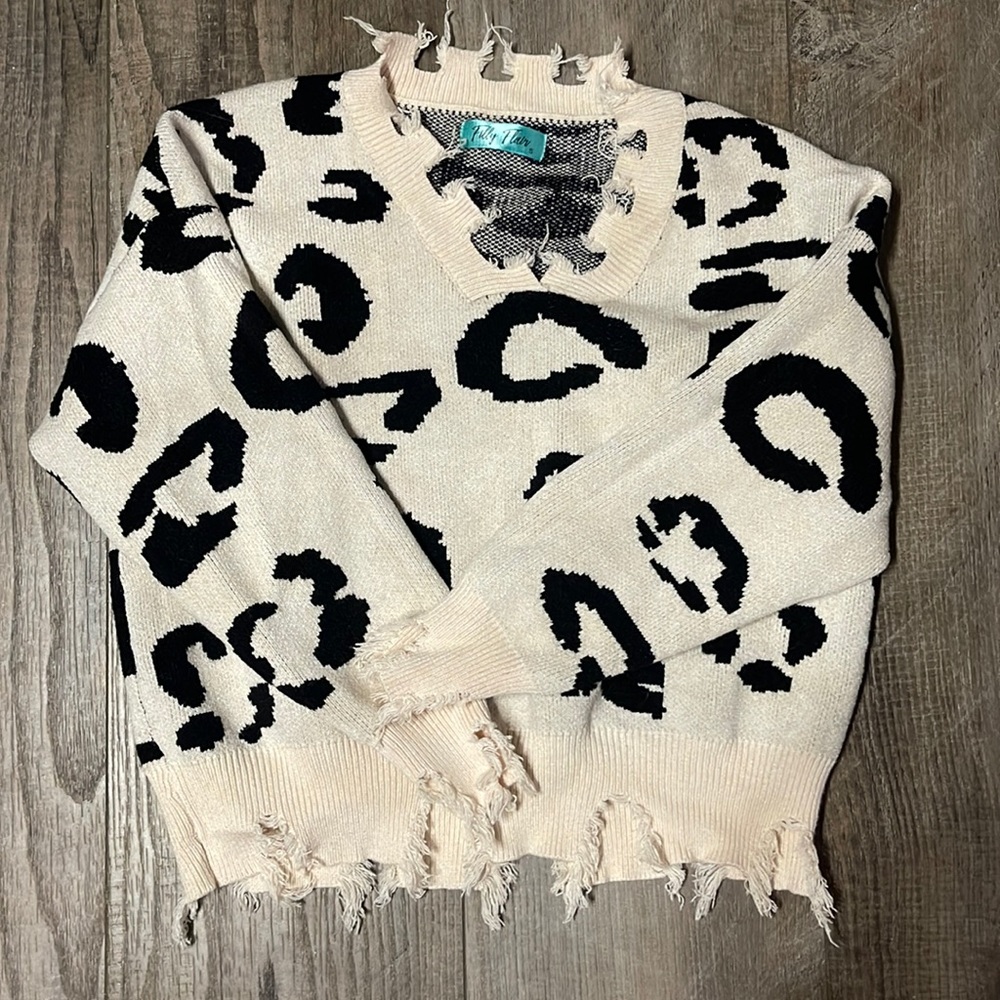 Distressed animal print sweater